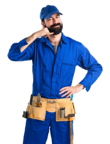 A worker in blue coveralls and a tool belt making a phone call gesture with their hand.